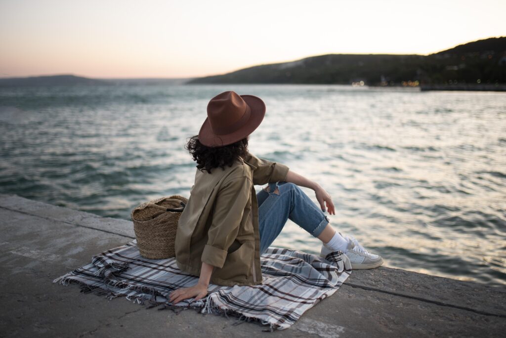 woman sitting blanket full shot (1)